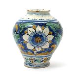 A Sicilian maiolica vase or jar, 18th century, painted with large flowerheads and foliate scrolls in