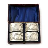 A set of four Thomas Goodfellow Aesthetic Movement silver napkin rings, in original presentation