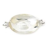 An R.E. Stone silver porringer retailed by Wilson & Gill, elliptical shallow bowl set with two