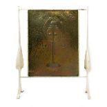 A Glasgow School patinated brass and metal firescreen, the rectangular panel stamped in low relief