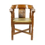 A Robert Mouseman Thompson oak armchair, curved back with lattice panels, carved legs and carved
