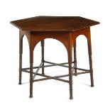 A Liberty & Co mahogany Moorish table, hexagonal top on turned legs with Star of David stretcher,