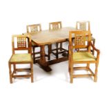 A Robert Mouseman Thompson oak Refectory Dining table and five chairs, the rectangular table with