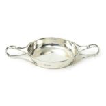 An A.E. Jones silver twin-handled porringer, model no.501, the shallow bowl with two pulled wirework