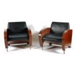 A pair of Art Deco style walnut veneer tub chairs, angled with chrome tube front legs and and bun