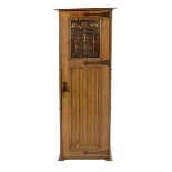 A Shapland & Petter oak hall wardrobe, single hinged door with patinated copper Art Nouveau floral