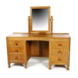 A Robert Mouseman Thompson oak dressing table, rectangular with two banks of three drawers, with