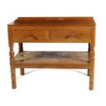 A Robert Mouseman Thompson oak Hall table, rectangular carved adzed top, two drawers above open