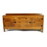 A Robert Mouseman Thompson oak sideboard, rectangular with adzed top, two cupboards flanking central