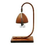 A leather stirrup table lamp in the style of Hermes, with chrome fittings unsigned, 37cm. high