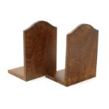 A pair of oak bookends by Edward Barnsley, simple arched, rectangular form, with dove tail joints