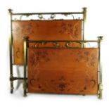 An Art Nouveau brass mounted marquetry bed in the manner of Emile Galle, the head and foot boards