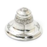 A Liberty & Co silver inkwell probably designed by David Veasey, model no.5723, circular section