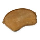 A Robert Mouseman Thompson oak tea tray, model GS150, kidney shaped with carved mouse signature