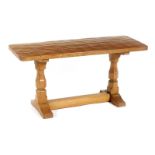 A Robert Mouseman Thompson oak Refectory Coffee table, rectangular adzed top, two turned legs with