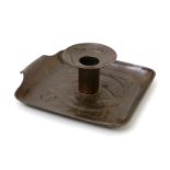 A Newlyn Industrial Class patinated copper candlestick, the square section tray repousse hammered