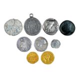 A small collection of ancient and early medieval coins, including: Byzantium: Focus (602-610, gold