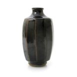 ‡ Geoffrey Whiting (1919-1988) an Avoncroft cut-sided stoneware bottle vase, covered to the foot