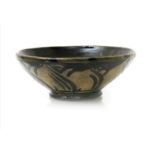 ‡ Norah Braden (1901-2001) a stoneware bowl, painted with simple foliage design to inside and out,