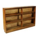 An oak double bookcase by Edward Barnsley, rectangular form each with three graduated shelves.