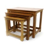 A Robert Mouseman Thompson oak nest of three occasional tables, graduated rectangular section,