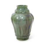 A Carter's Poole Pottery lustre vase designed by Owen Carter, dated 1906, the swollen, gadrooned