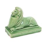 Carter's Tiles Poole an advertising paperweight, modelled as a lion dormant holding a shield,