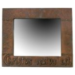 An Arts and Crafts copper wall mirror, rectangular hammered copper frame, stamped with inscription