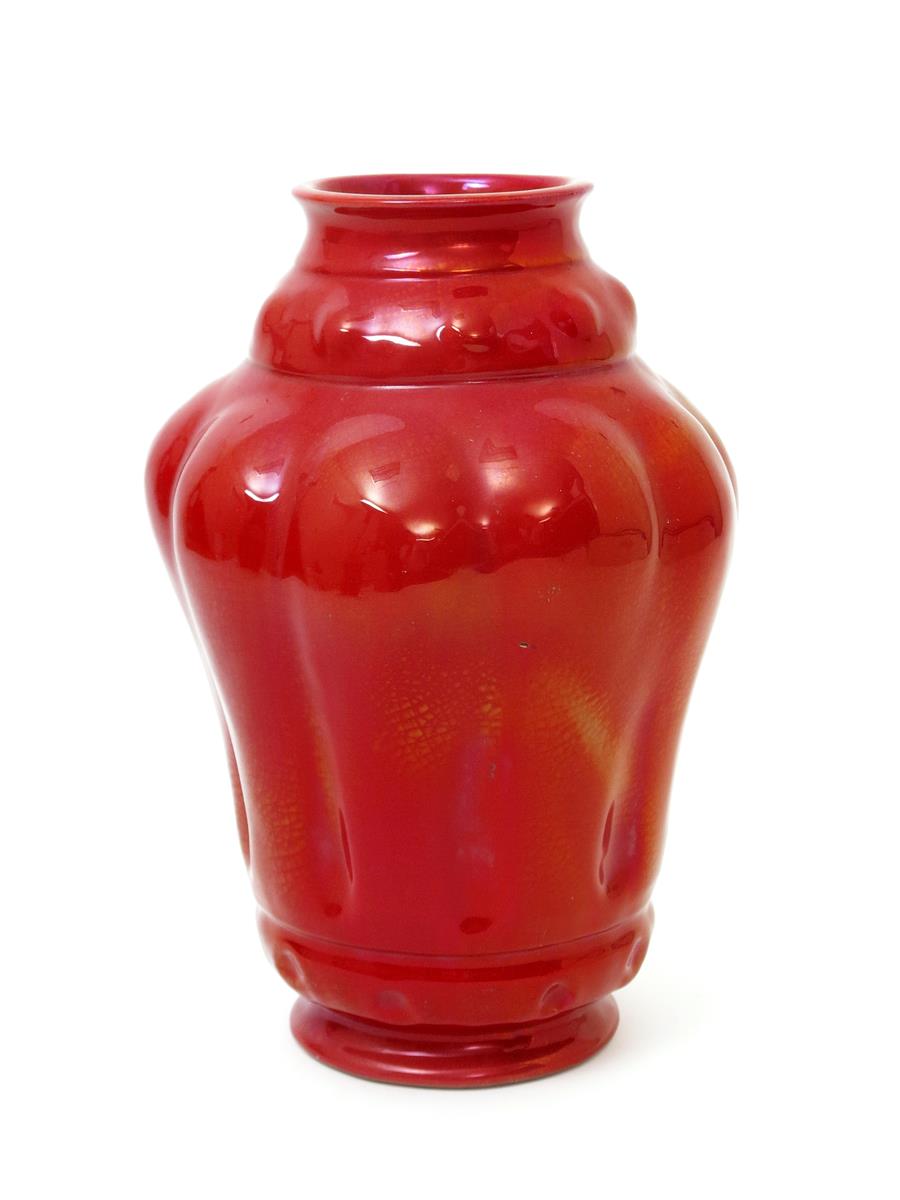 A Carter's Poole Pottery lustre vase designed by Owen Carter, dated 1904, the swollen, gadrooned