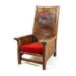 A Robert Mouseman Thompson Smoker's chair, with leather slung back, lattice leather seat and