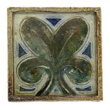 A Martin Brothers stoneware tile by Robert Wallace Martin, square, moulded with a simple leaf design