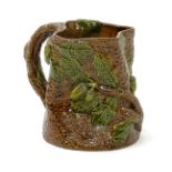 A large Rye Pottery jug, naturalistically modelled as an oak tree trunk, with acorns and foliage,
