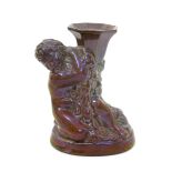 A rare Carter Stabler & Adams Poole Pottery lustre candlestick designed by Harold Brownsword,