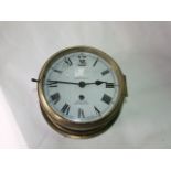 A Smiths marine bulkhead clock with part brass case, enamel dial and eight day timepiece