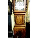 A substantial 19th century mahogany longcase clock, the trunk with spiral column supports, the