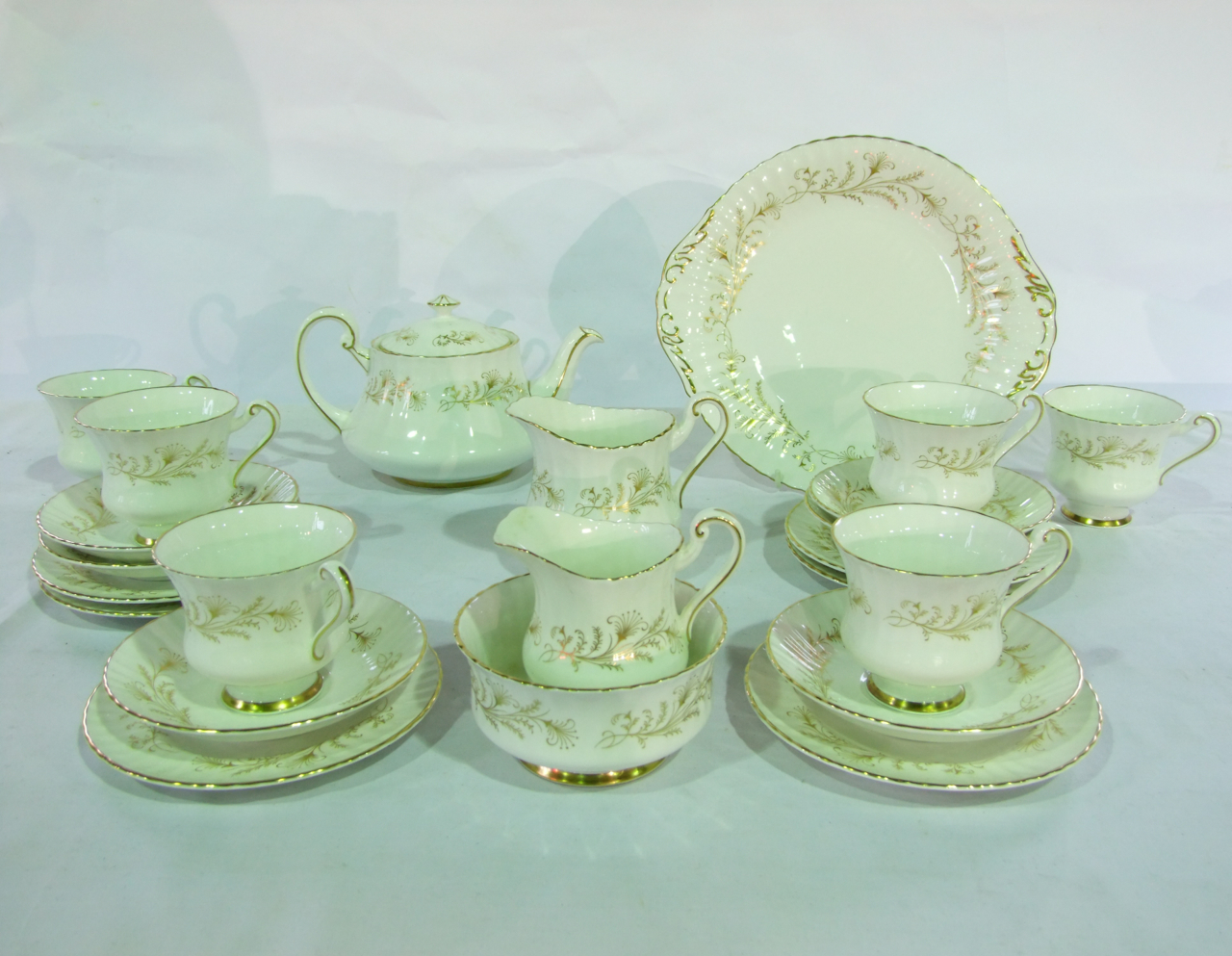 a collection of Paragon China Lafayette pattern tea wares with gilt floral sprig detail comprising