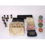 Four millefiori type glass paperweights together with a selection of ladies evening bags, purses,