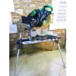 An Hitachi C12RSH laser electric disc mitre saw and adjustable stand, together with a transformer