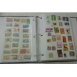 A ring binder stamp album containing a large quantity of mixed worldwide stamps together with a