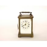 A simple brass carriage clock with eight day timepiece