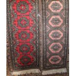 A miniature eastern wool work runner with red central field and medallions in shades of brown and