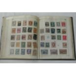 Four old Lincoln stamp albums containing a quantity of mixed stamps