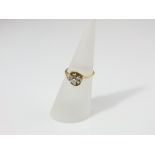An 18ct gold diamond cluster ring set with nine stones, size L