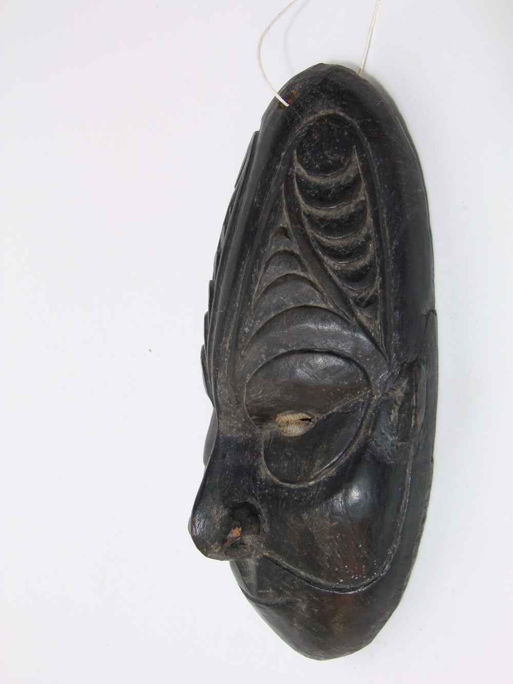 An old African hardwood facial mask with Cowrie shell eyes and geometric carving to the forehead - Image 2 of 2