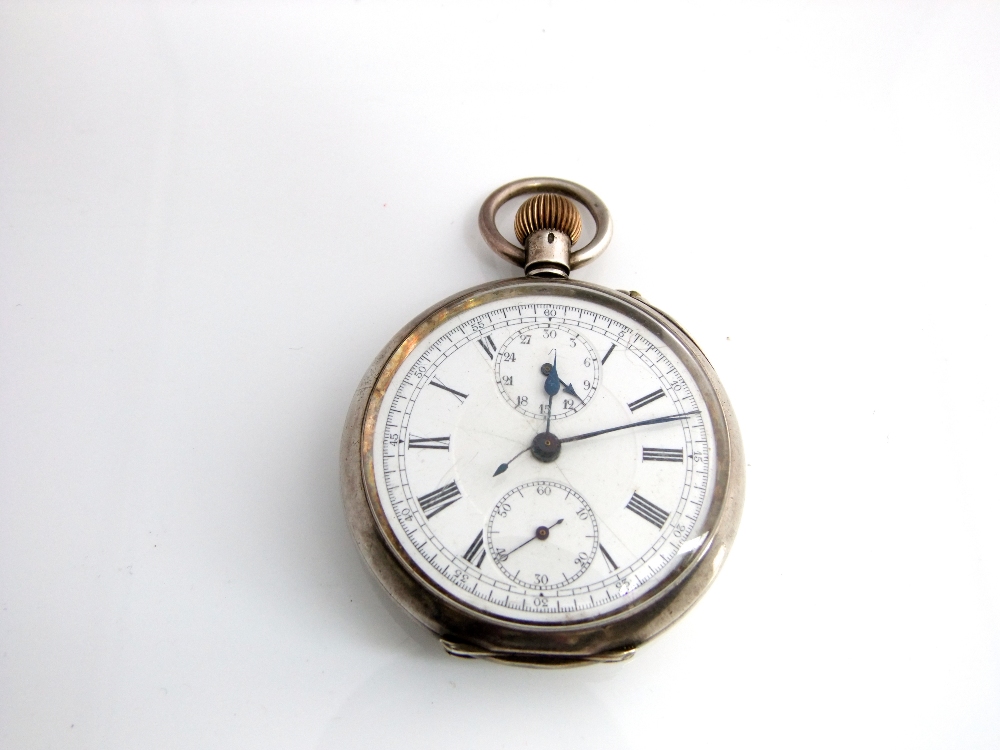 A silver cased chronograph pocket watch with white enamel dial (movement working)