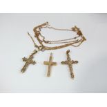 Three 9ct gold crucifix and two fine link chains, 8 gms