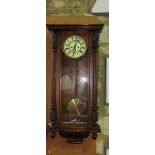 A 19th century Vienna wall clock by Gustave Becker with 2 weight mechanism, the walnut case with