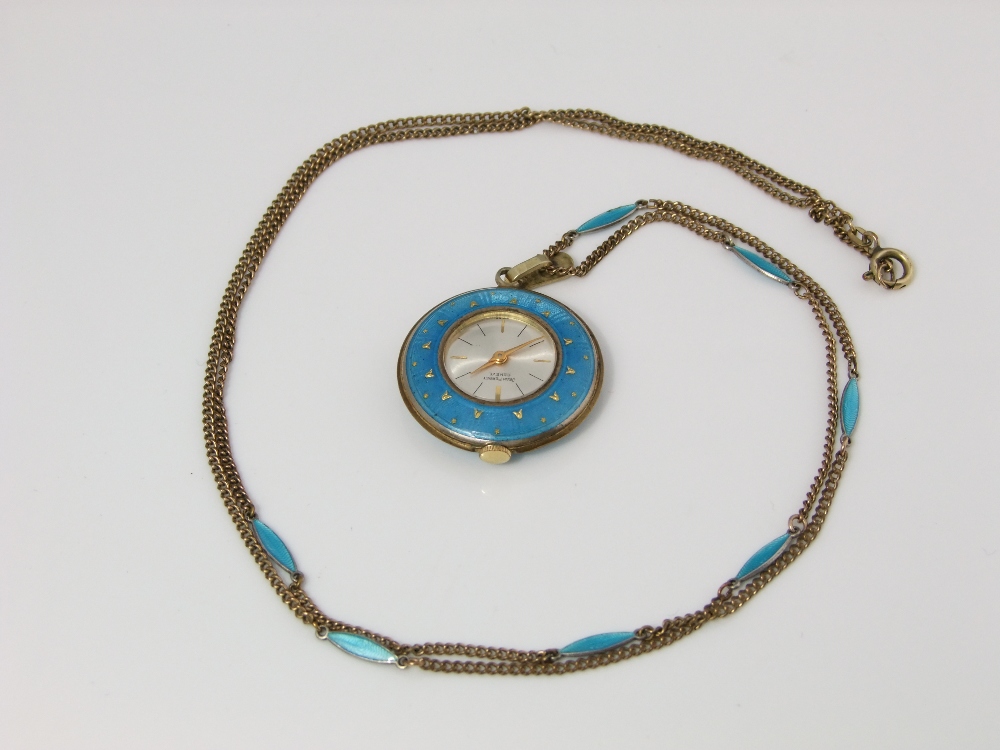 A Jean Perret of Geneva pendant watch set in a pale blue enamel and gilt framework the chain with