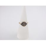 An 18ct gold and diamond cluster ring set with 20 diamonds, size L