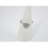 A 14ct white gold diamond cluster ring, the seven diamonds set on a floral theme, 1.2cts approx